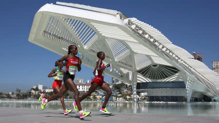 2016 Rio Olympics - Athletics - Final - Women's Marathon -Sambodromo - Rio de Janeiro, Brazil - 14/08/2016. Jemima Sumgong (KEN) of Kenya, Mare Dibaba (ETH) of Ethiopia and Eunice Jepkirui Kirwa (BRN) of Bahrain lead the race REUTERS/Pilar Olivares