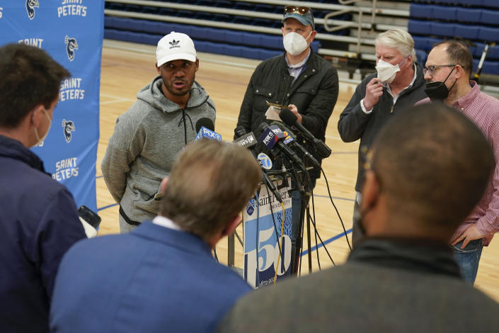 St. Peter's basketball coach Shaheen Holloway talks to reporters before NCAA college basketball practice in Jersey City, N.J., Tuesday, March 22, 2022. (AP Photo/Seth Wenig)