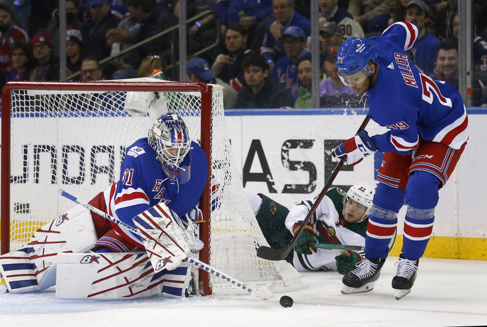 New York Rangers' goalie Igor Shesterkin (31) and teammate K'Andre Miller (79) defend against Minnesota Wild's Kevin Fiala (22) during the second period of an NHL hockey game Friday, Jan. 28, 2022, in New York. (AP Photo/John Munson)