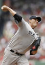 BOSTON, MA - JULY 7: Freddy Garcia #36 of the New York Yankees pitches during the first inning of game one of a doubleheader against the Boston Red Sox at Fenway Park on July 7, 2012 in Boston, Massachusetts. (Photo by Winslow Townson/Getty Images)