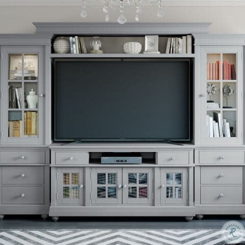 Large gray entertainment center housing a large TV in the center