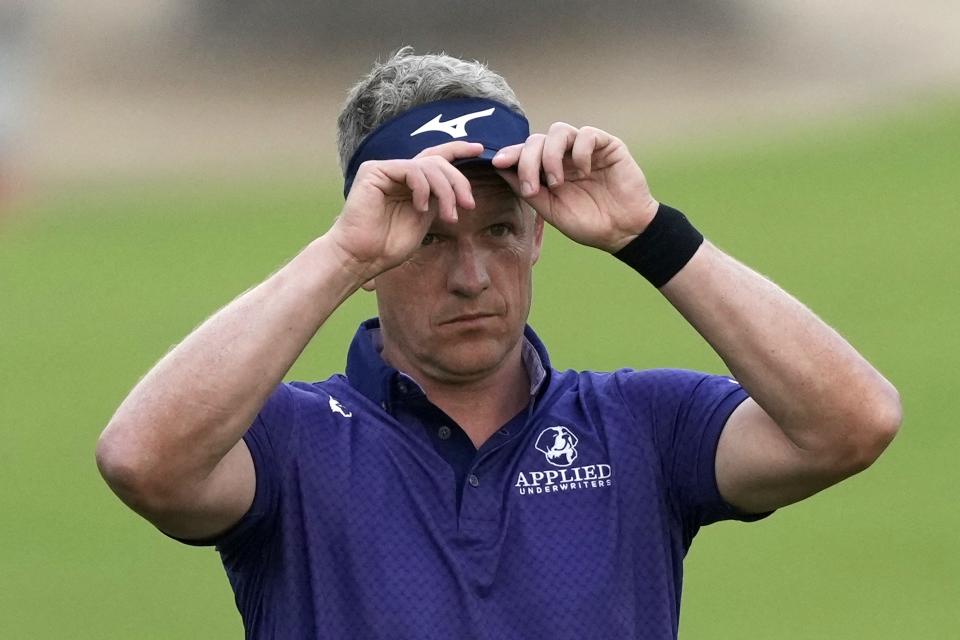 Luke Donald of England fixes his cap on 10th hole during the second round of the Hero Dubai Desert Classic golf tournament, in Dubai, United Arab Emirates, Friday, Jan. 19, 2024. (AP Photo/Kamran Jebreili)