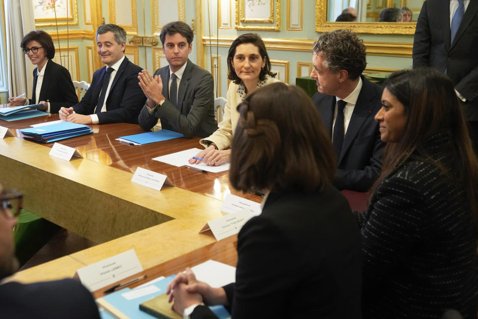 Newly appointed French Culture Minister Rachida Dati, left, French Interior Minister Gérald Darmanin, second from left, new French prime minister Gabriel Attal, center, and newly appointed French Minister of Education, Sports, and Olympic Games, Amelie Oudea-Castera, right, attend the weekly cabinet meeting after a cabinet reshuffle, Friday, Jan. 12, 2024 at the Elysee Palace in Paris. (AP Photo/Michel Euler, Pool)