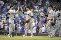 Miami Marlins celebrate their 3-0 win over the Chicago Cubs, Sunday, Aug. 7, 2022, at Wrigley Field in Chicago. (AP Photo/Mark Black)