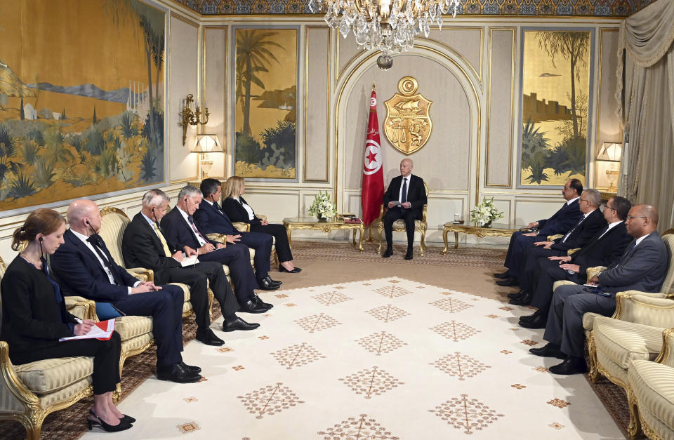 CORRECTS BYLINE Tunisian President Kais Saied, center, welcomes French Interior Minister Gerald Darmanin, fifth left, and German Interior Minister Nancy Faeser, center left, to the presidential palace in Carthage, Tunisia, Monday June 19, 2023. (Slim Abid/Tunisian Presidential Palace via AP)