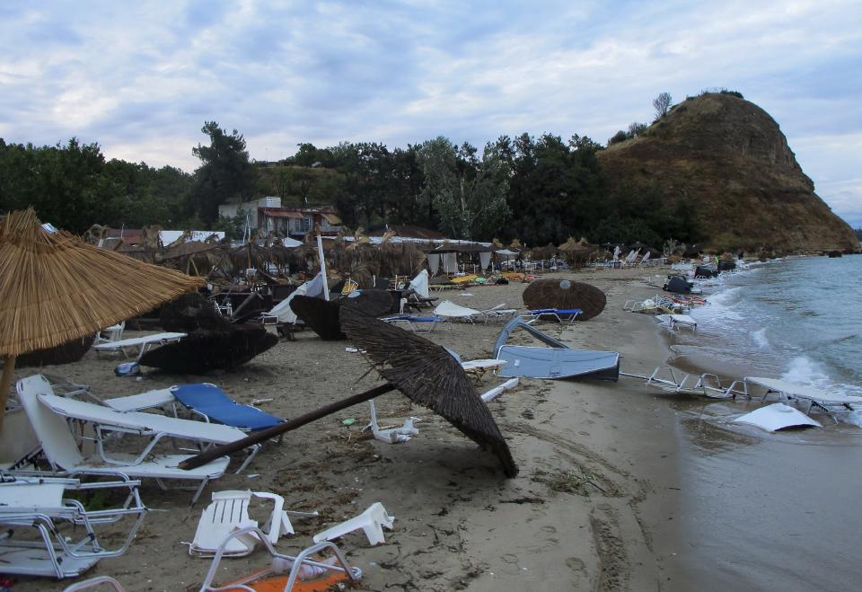 Debris are seen after a storm on a beach at Vergia village in Halkidiki region, northern Greece on Thursday, July 11, 2019. A powerful storm hit the northern Halkidiki region late Wednesday. (Giannis Moisiadis/InTime News via AP)