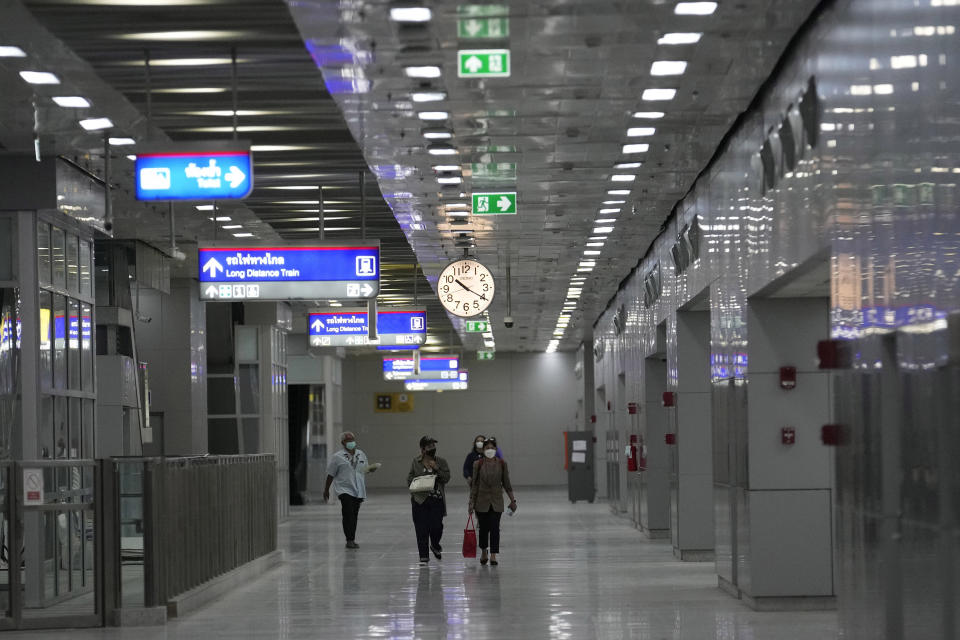 Passengers walk through the corridors of the massive Krung Thep Aphiwat Central Terminal in Bangkok, Thailand, Thursday, Jan. 19, 2023. Thailand ushered in a new age of train travel on Thursday when what’s said to be Southeast Asia’s biggest railway station officially began operations. (AP Photo/Sakchai Lalit)