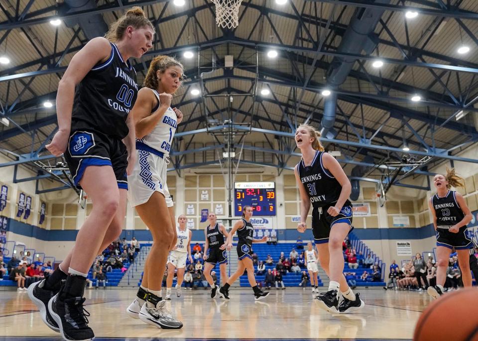 Jennings County Panthers Juliann Woodard (00) knocks the ball against Franklin Community Grizzly Cubs forward Aubrey Runyon (1) as Jennings County Panthers Mollie Ernstes (31) yells in excitement Thursday, Jan. 25, 2024, during the game at Franklin Community High School in Indianapolis. The Jennings County Panthers defeated the Franklin Community Grizzly Cubs, 51-44.