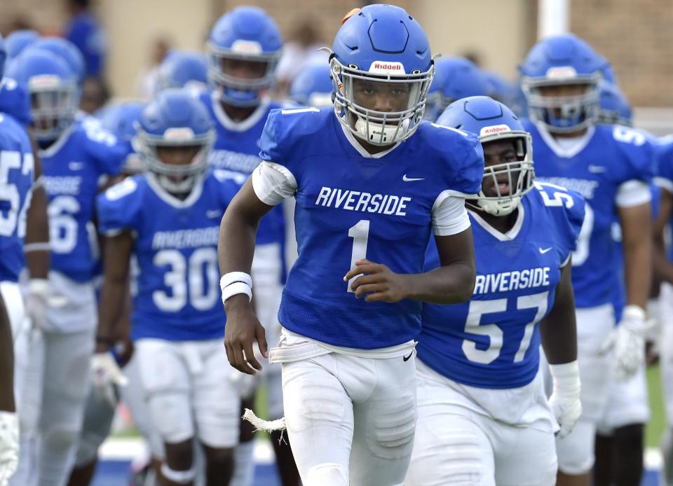 Receiver Myles Kendrick (1) leads Riverside's team onto the field for preseason against Bartram Trail. The Generals play White on Friday in a game with the District 3-2M title at stake.