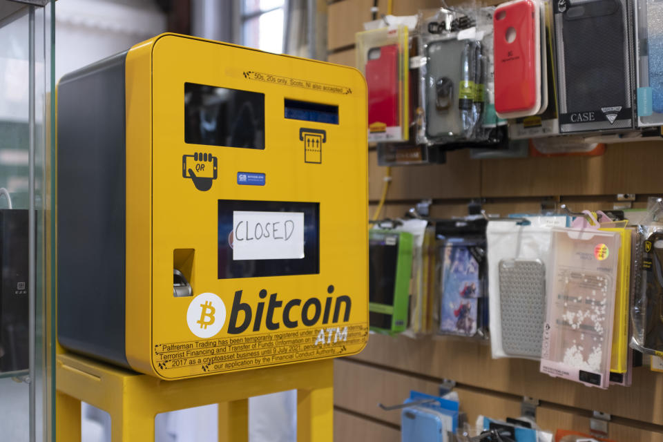 An ATM that can be used to exchange regular currency for Bitcoin stands faulty in a market stall in Leeds, UK