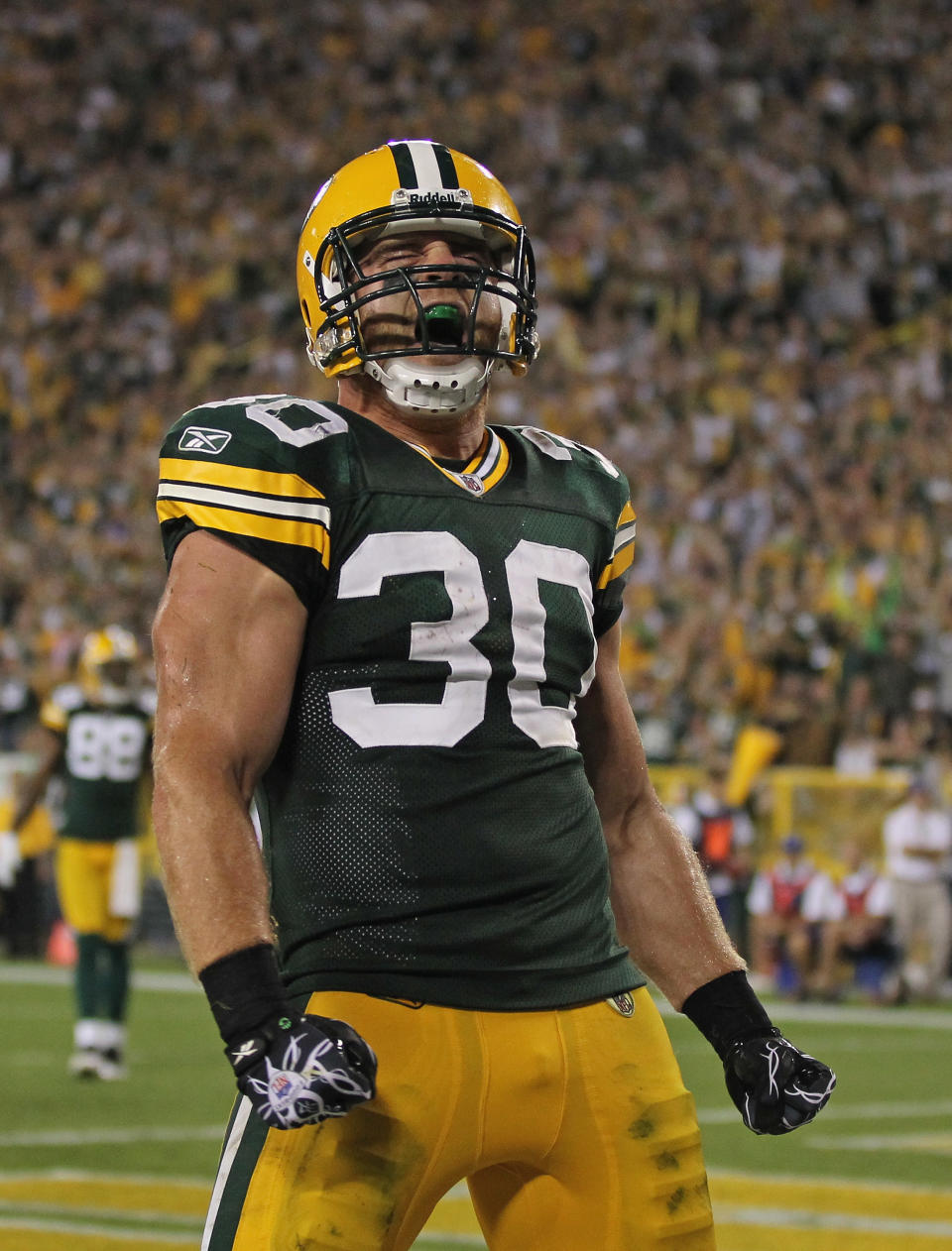 GREEN BAY, WI - SEPTEMBER 08: John Kuhn #30 of the Green Bay Packers celebrates after scoring a touchdown against the New Orleans Saints during the NFL opening season game at Lambeau Field on September 8, 2011 in Green Bay, Wisconsin. (Photo by Jonathan Daniel/Getty Images)