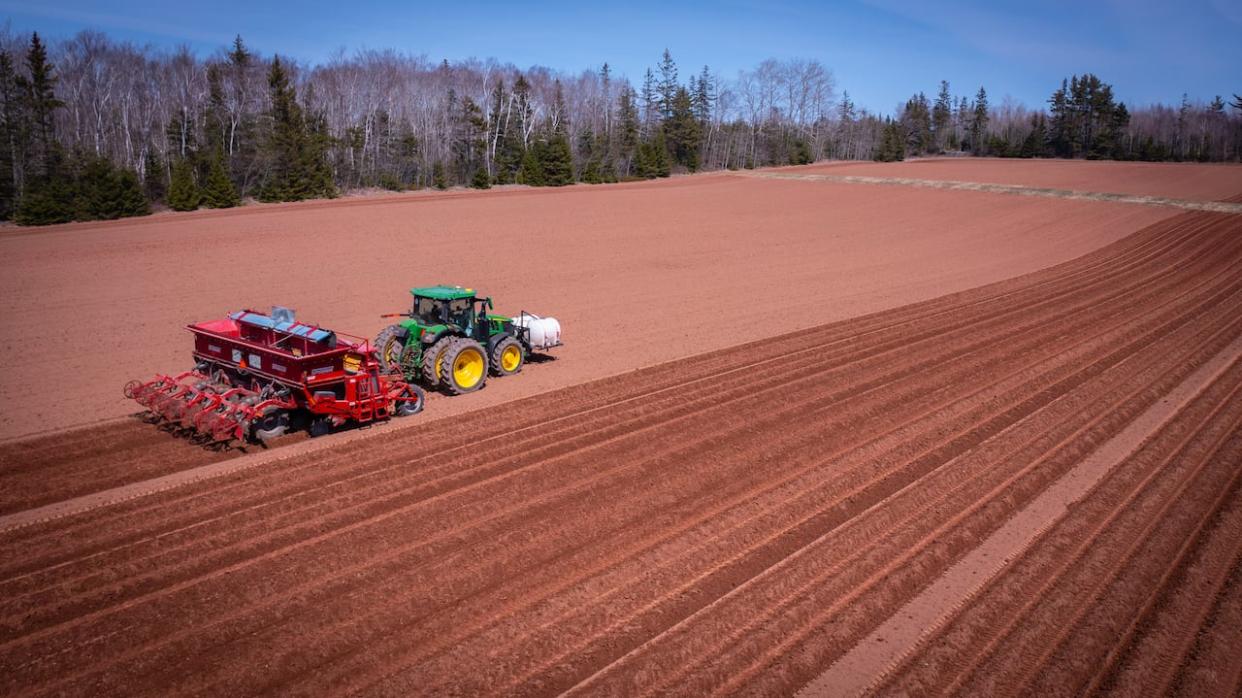 What's going on under the hood of farm equipment is increasingly complicated. (Shane Hennessey/CBC - image credit)