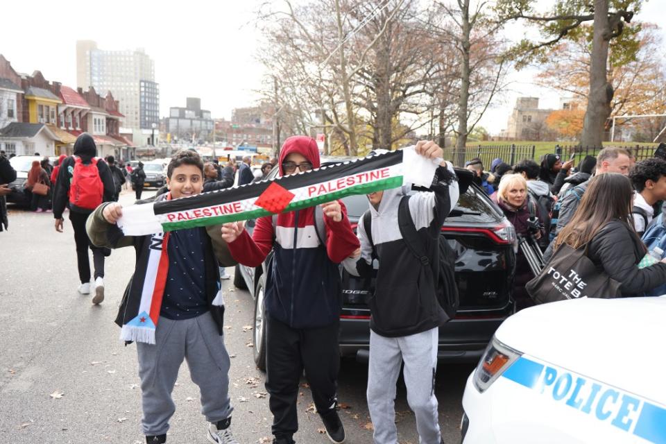 Hillcrest High School students holding up a Palestinian banner outside the school on Nov. 27, 2023. Dennis A. Clark