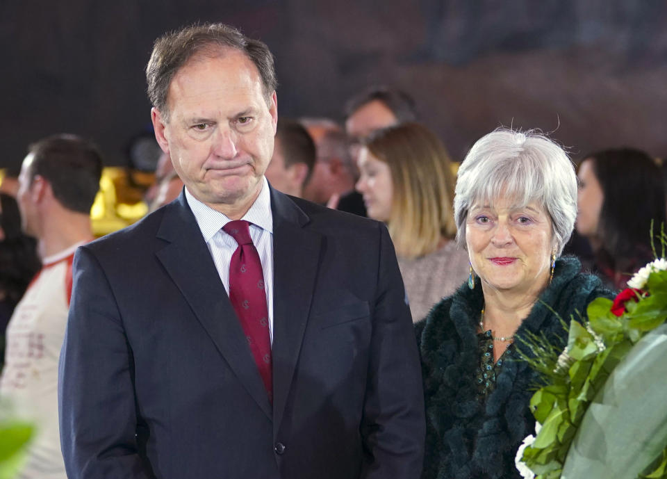 FILE - Supreme Court Justice Samuel Alito Jr., left, and his wife Martha-Ann Alito, pay their respects at the casket of Reverend Billy Graham at the Rotunda of the U.S. Capitol Building in Washington, Feb. 28, 2018. Alito rejects calls to step aside from Supreme Court cases on Trump and Jan. 6. (AP Photo/Pablo Martinez Monsivais, File)