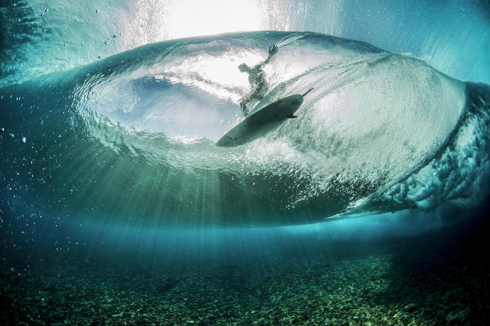 &ldquo;The surface of the ocean was like perfect glass, and was perfect for shooting underwater,&rdquo; says photographer <strong>Ben Thouard</strong> of his image of surfer <strong>Landon McNamara</strong> riding a wave in Teahupoo, Tahiti. &ldquo;I had been trying to get this shot for some time without much success. When I saw the wave coming, I dove under and turned back to look from behind the wave. The sun was coming from right through the lip of the wave, and I knew that I wanted to catch the surfer coming through the light,&rdquo; he says. Factors beyond his control came together to make the picture work, he says. &ldquo;It&rsquo;s not often that I get impeccable water clarity, no wind, good waves, and light all in one frame. The result ended up being pretty amazing!&rdquo; Thouard adds that, after spending his entire day underwater and shooting from below the surface, he had no idea who the surfer in this shot was. &ldquo;I didn&rsquo;t have time to check the pictures until I got home,&rdquo; he says. &ldquo;But thanks to social media, a year later, I was able to identify Landon in the photo.&rdquo;