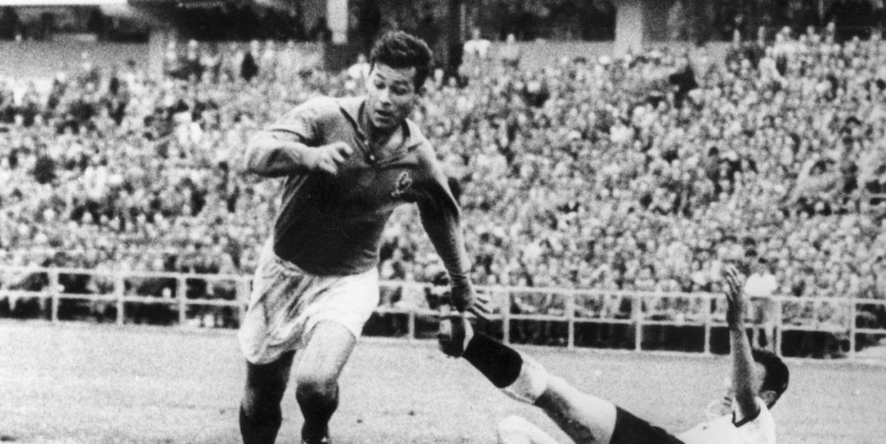 just fontaine handles soccer ball next to goalkeeper on ground