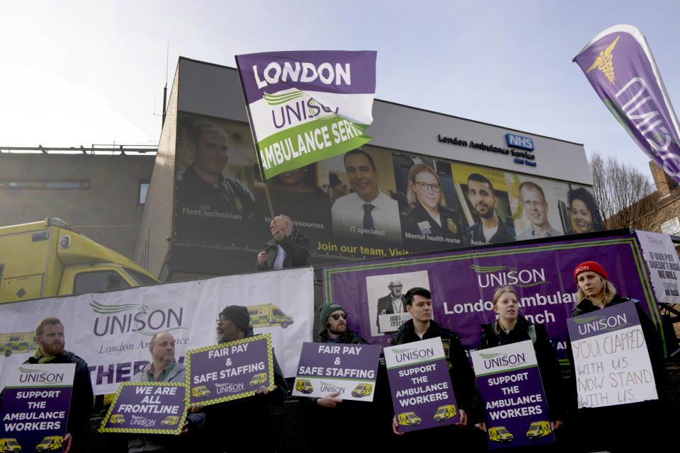 Ambulance workers stand on a picket line during a strike by members of the Unison union in the long-running dispute over pay and staffing, in London, Friday, Feb. 10, 2023.(AP Photo/Kirsty Wigglesworth)