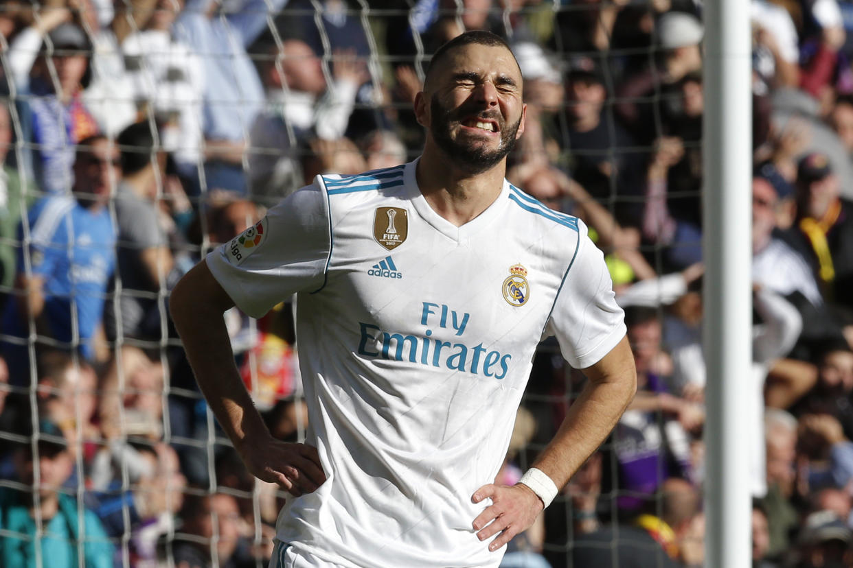 Real Madrid’s Karim Benzema reacts during the Spanish La Liga soccer match between Real Madrid and Barcelona at the Santiago Bernabeu stadium in Madrid, Spain, Saturday, Dec. 23, 2017. (AP Photo/Paul White)