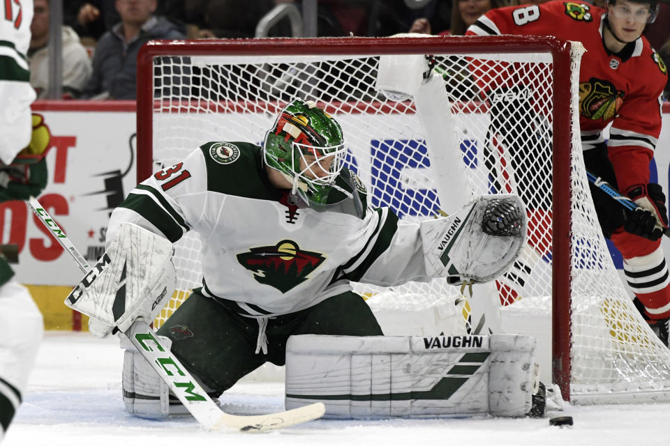 Minnesota Wild goalie Kaapo Kahkonen (31) of Finland, makes a save during the second period of an NHL hockey game against the Chicago Blackhawks, Sunday, Dec. 15, 2019, in Chicago. (AP Photo/Paul Beaty)