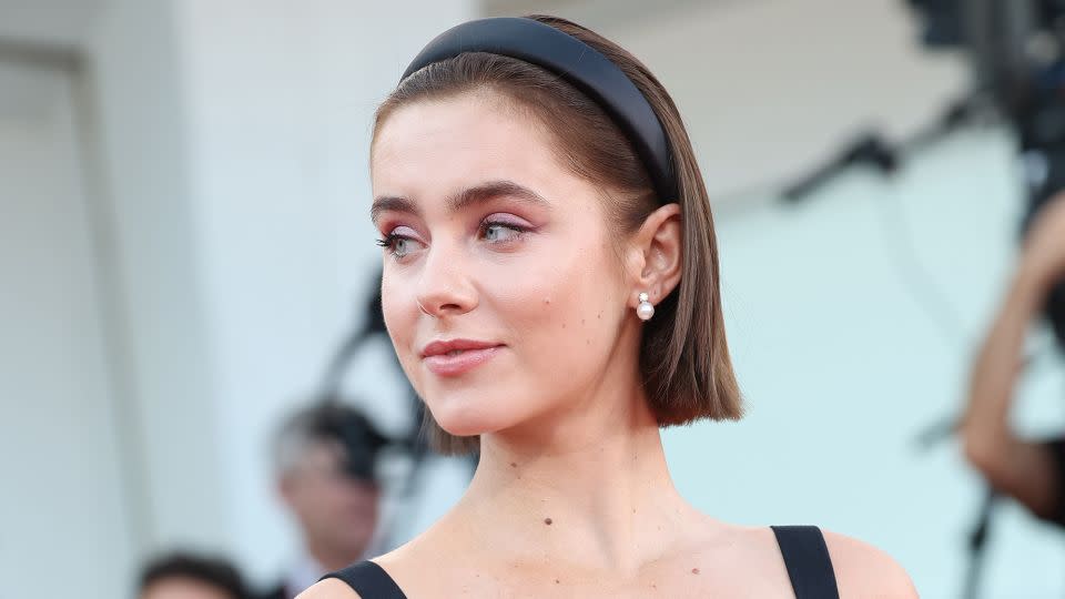 Spanish actress and model Clara Galle wore a black Giorgio Armani dress adorned with a bow and a chic black headband. - Vittorio Zunino Celotto/Getty Images