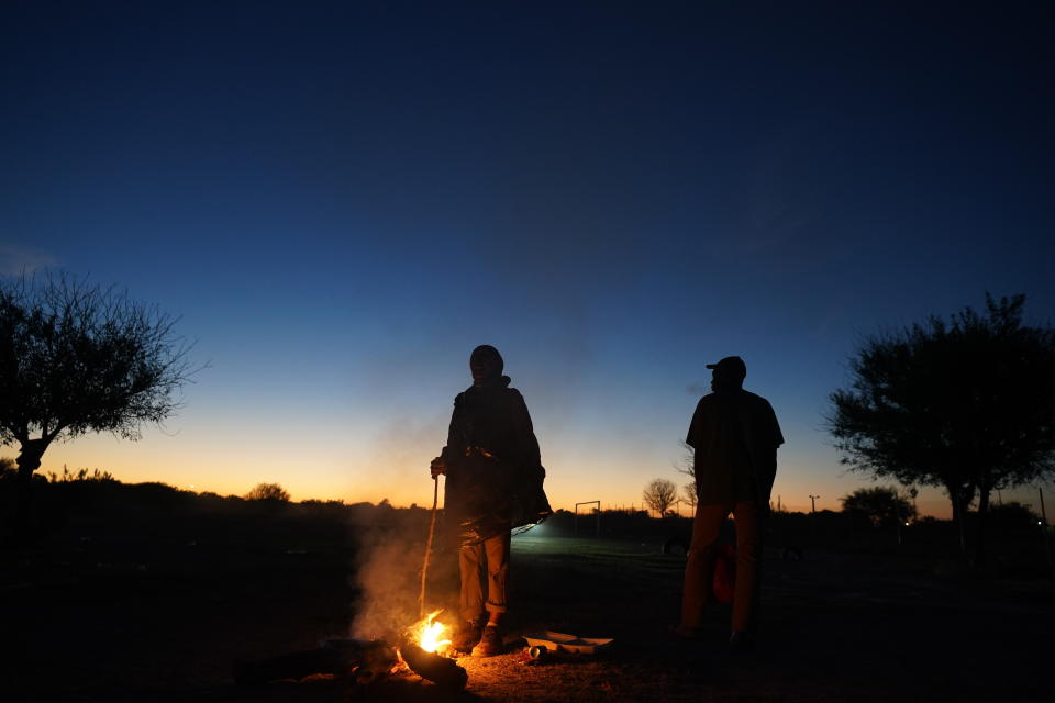 Migrants trying to reach the U.S., many from Haiti, camp out in Ciudad Acuna, Mexico, at dawn Thursday, Sept. 23, 2021, across the Rio Grande river, the natural border with Del Rio, Texas. (AP Photo/Fernando Llano)