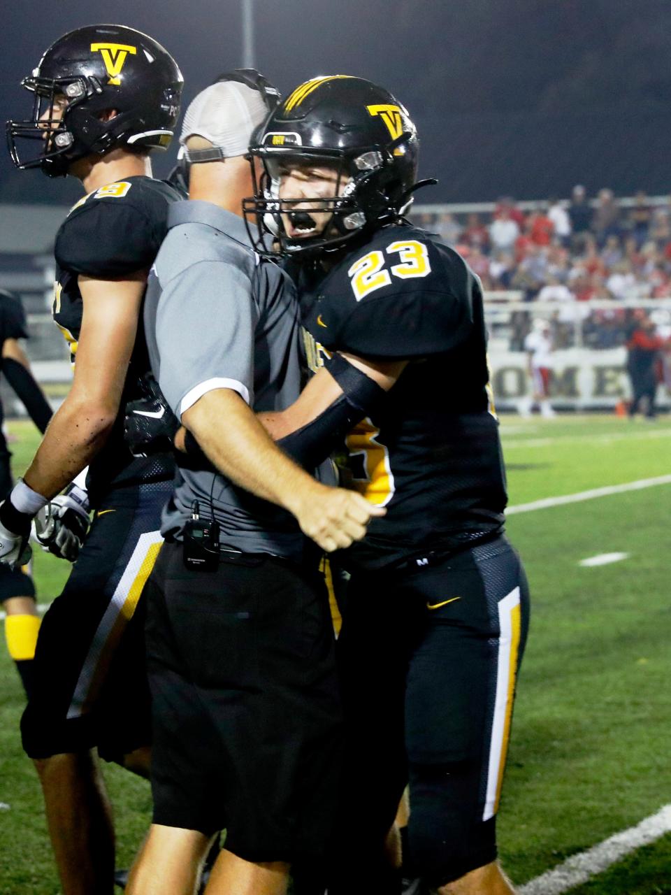 Tri-Valley senior Ashton Sensibaugh hugs head coach Cameron West following his team's 14-13 win agaisnt visiting Jackson on Friday night at Jack Anderson Stadium. Sensibaugh had a 65-yard touchdown catch and led the team in receiving yards.