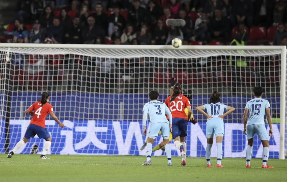 Chile's Francisca Lara, left, hits the crossbar from the penalty spot during the Women's World Cup Group F soccer match between Thailand and Chile at the Roazhon Park in Rennes, France, Thursday, June 20, 2019. (AP Photo/David Vincent)