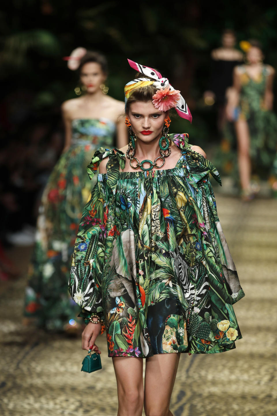 Models wear creations as part of the Dolce & Gabbana Spring-Summer 2020 collection, unveiled during the fashion week, in Milan, Italy, Sunday, Sept. 22, 2019. (AP Photo/Antonio Calanni)
