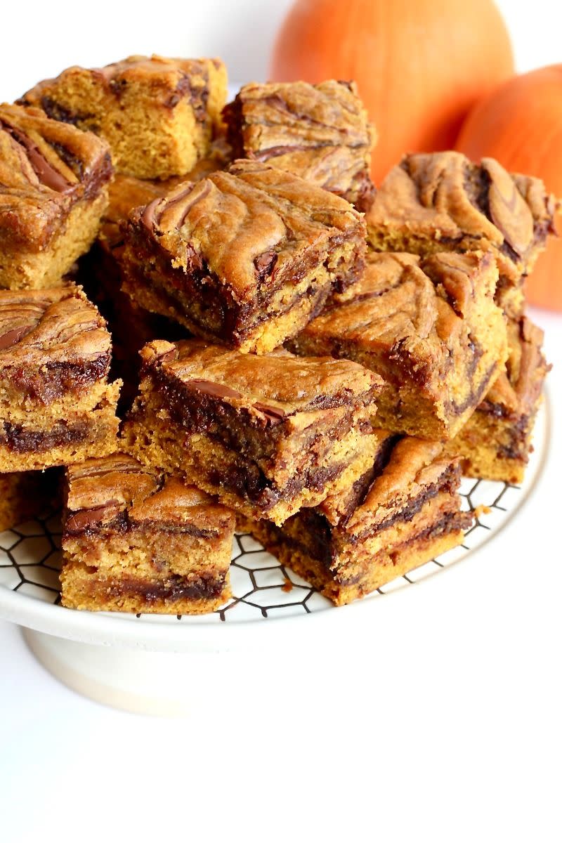 <p>Two of the greatest fall flavors—Nutella and pumpkin—come together in these amazing cake bars. </p><p><strong>Get the recipe at <a href="https://thebakermama.com/recipes/nutella-swirled-pumpkin-cake-bars/" rel="nofollow noopener" target="_blank" data-ylk="slk:The BakerMama;elm:context_link;itc:0;sec:content-canvas" class="link ">The BakerMama</a>.</strong> </p>