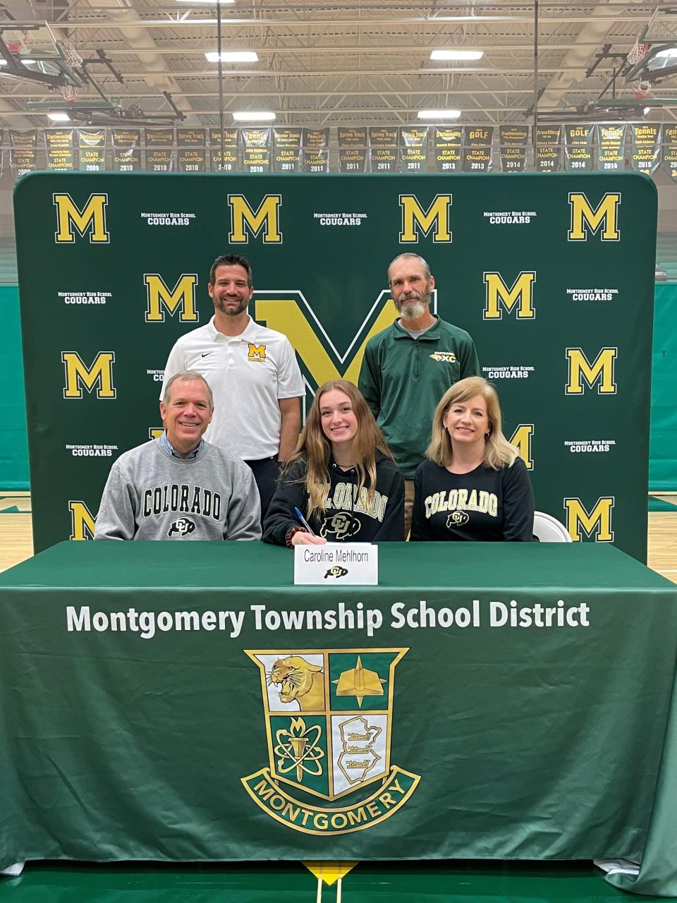 Montgomery's Caroline Melhorn signs her National Letter of Intent to run cross country and track at the University of Colorado on Wednesday, Nov. 10, 2021.