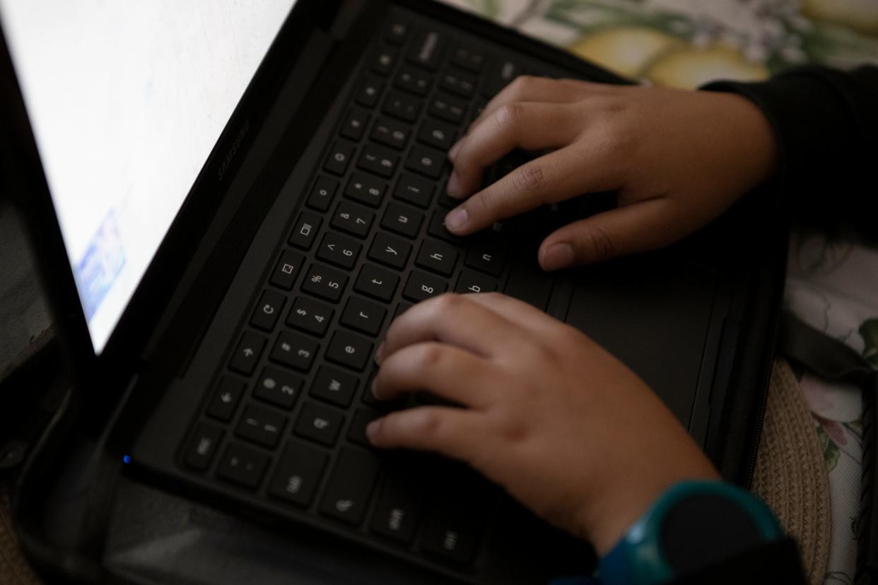 Camilo Ortiz, 8, places his hands on his Chromebook to compete a typing lesson on Friday, March 20, 2020. Chromebooks will are now available for checkout from the Palm Springs Public Library.