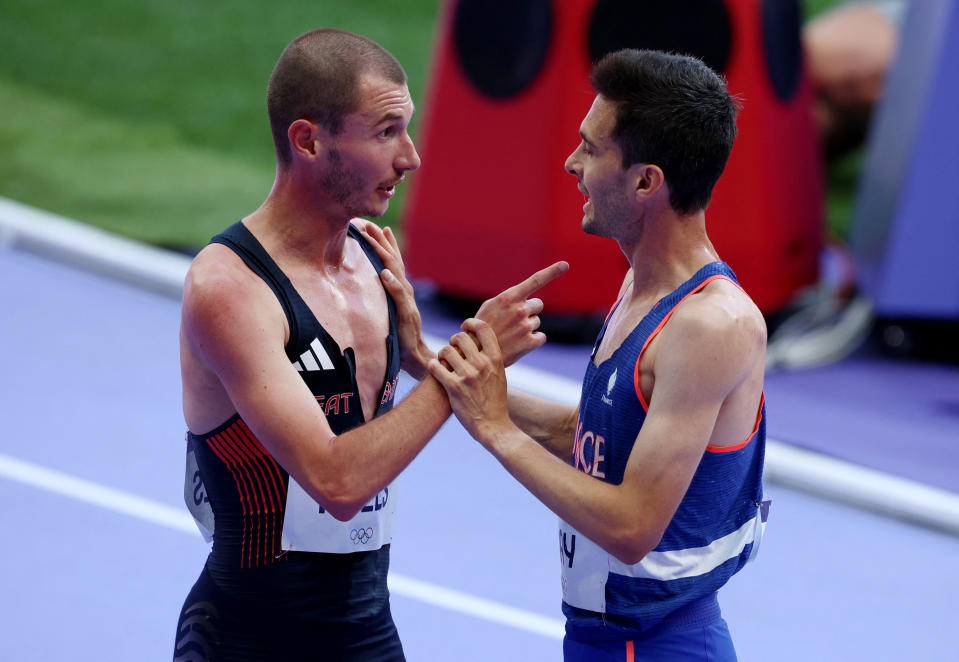 Great Britain's George Mills argues with France's Hugo Hay after they tangled in the Olympic 5000m heats at the Stade de France (Reuters via Beat Media Group subscription)