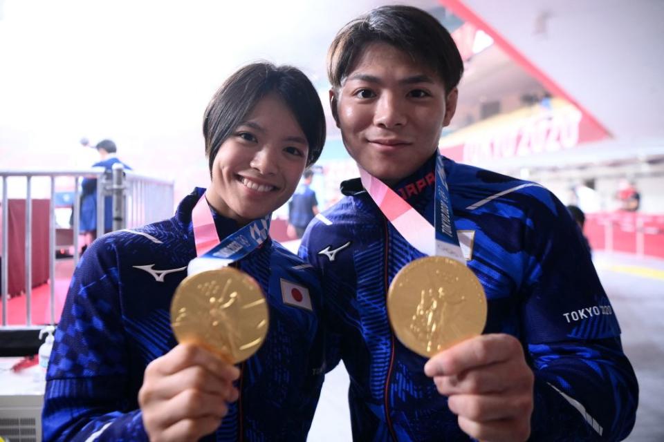 Japan's Hifumi Abe, the gold medallist of the judo men's -66kg contest of the Tokyo 2020 Olympic Games, and his sister Uta Abe, the gold medallist of the judo women's -52kg contest of the Tokyo 2020 Olympic Games, pose with their medals before the final block of the day three of judo competition during the Tokyo 2020 Olympic Games at the Nippon Budokan in Tokyo on July 26, 2021.<span class="copyright">Franck Fife—AFP via Getty Images</span>