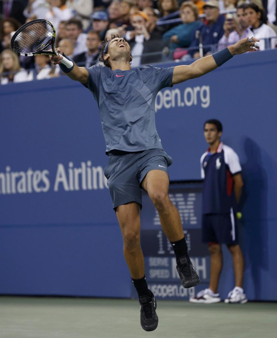 Nadal of Spain celebrates after defeating Djokovic of Serbia in their men's final match at the U.S. Open tennis championships in New York