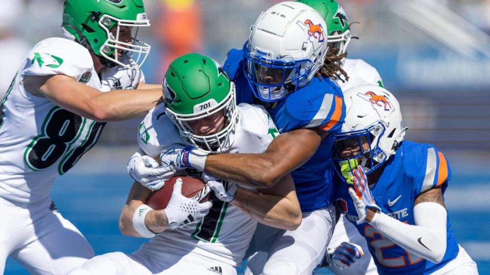 Boise State safety Zion Washington wraps up North Dakota receiver Bo Belquist in the third quarter of Saturday’s win at Albertsons Stadium.