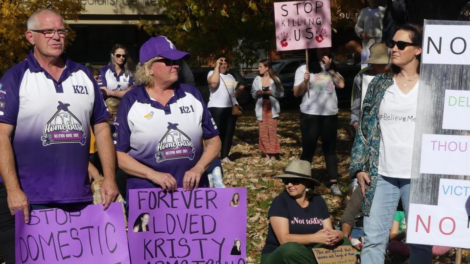The family of Kristy Armstrong (left, in purple) during a rally
