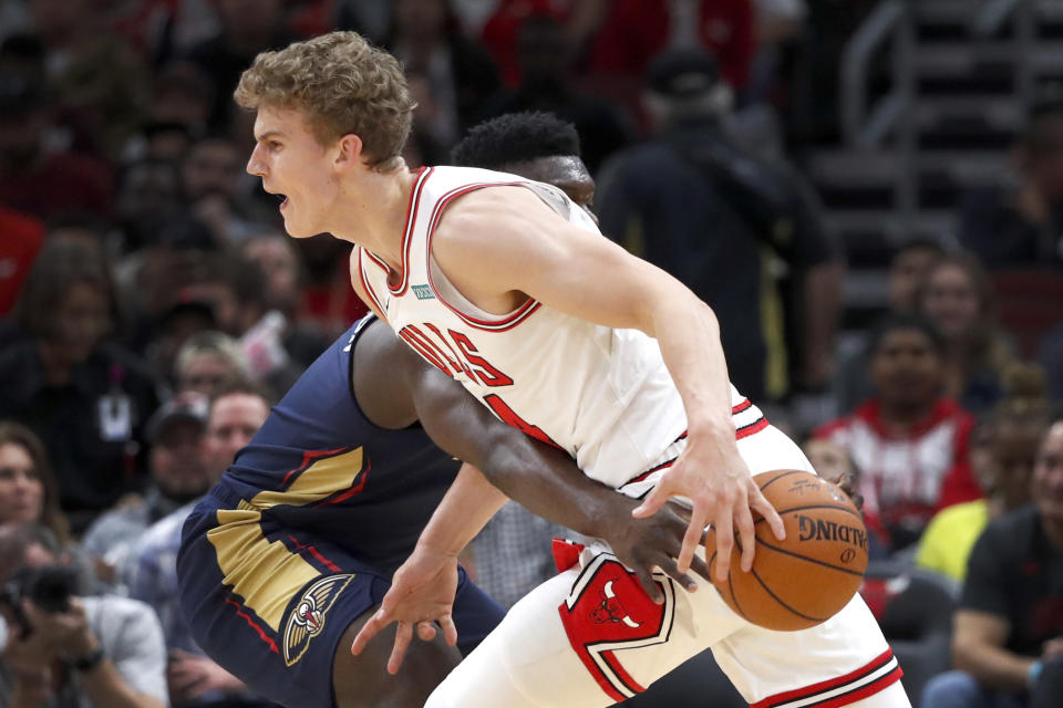 New Orleans Pelicans' Zion Williamson knocks the ball away from Chicago Bulls' Lauri Markkanen during the first half of an NBA preseason basketball game Wednesday, Oct. 9, 2019, in Chicago. (AP Photo/Charles Rex Arbogast)