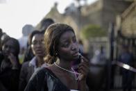 Markus Schreiber, a German photographer working for The Associated Press won the 1st Prize People - Observed Portraits Single category of the 2014 World Press Photo contest with this picture of a woman reacting in disappointment after access to see former South Africa President Nelson Mandela was closed on the third and final day of his casket lying in state, outside Union Buildings in Pretoria, South Africa, taken December 13, 2013. REUTERS/Markus Schreiber/World Press Photo Handout via Reuters