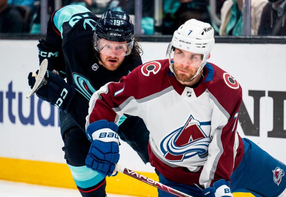 Seattle Kraken left wing Jared McCann (19) tries to defend Colorado Avalanche defenseman Devon Toews (7) during the first period of a first round 2023 Stanley Cup Playoffs game against the Colorado Avalanches at Climate Pledge Arena in Seattle on Saturday, April 22, 2023.