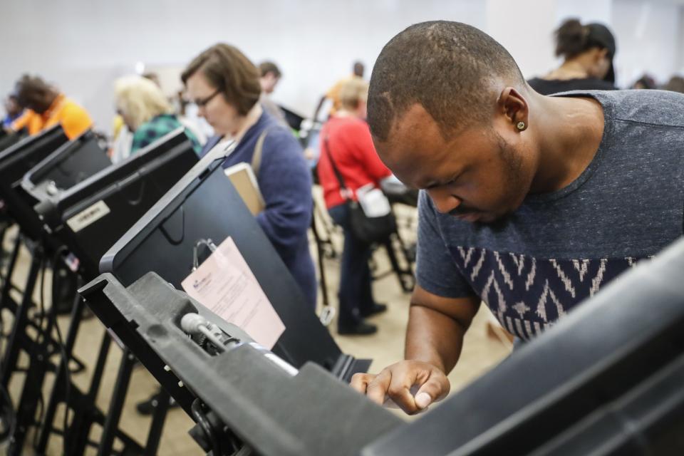 Elijah Ransom of Columbus, Ohio, votes early at the Franklin County Board of Elections, Monday, Nov. 7, 2016, in Columbus, Ohio. Heavy turnout has caused long lines as voters take advantage of their last opportunity to vote before election day. (Photo: /John Minchillo)