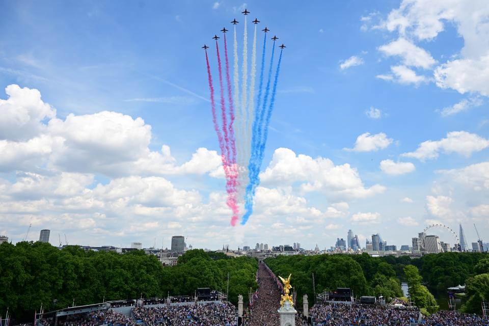 The Royal Air Force Aerobatic Team, the Red Arrows, fly in formation during a special flypast over the Buckingham Palace balcony. (Getty)