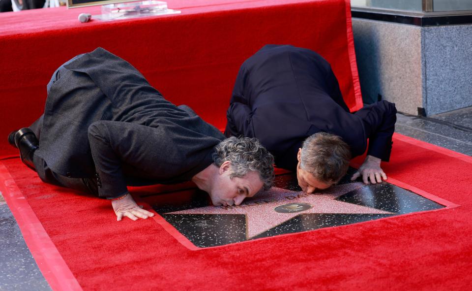 January 8, 2024: Actor Mark Ruffalo (L) and US actor Willem Dafoe kiss Dafoe's newly unveiled star during the ceremony honoring him with a Hollywood Walk of Fame star in Hollywood, California.