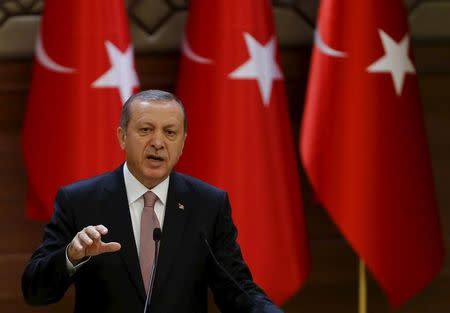 Turkish President Tayyip Erdogan makes a speech during his meeting with mukhtars at the Presidential Palace in Ankara, Turkey, November 26, 2015. REUTERS/Umit Bektas