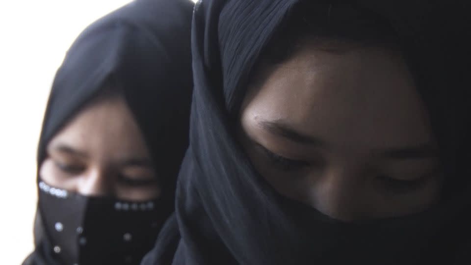 Girls, faces partially covered, attend class at a hidden school in Afghanistan. - CNN
