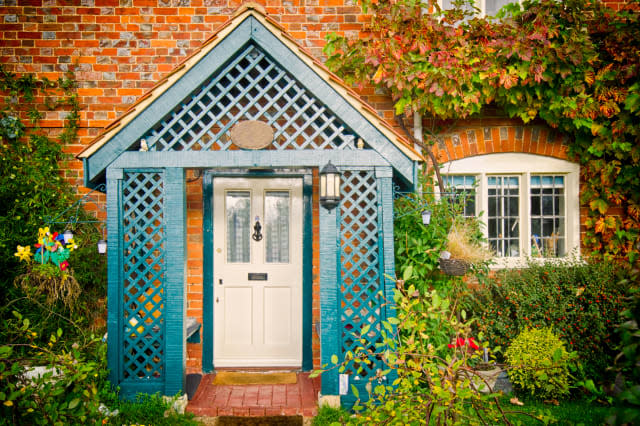 front of english house in autumn