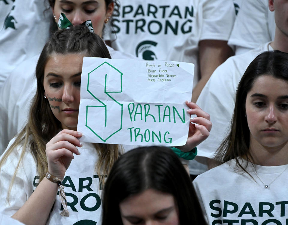 Feb 21, 2023; East Lansing, Michigan, USA; Michigan State Spartan students take part in a moment of memorial for the students killed and injured by a shooter last week on campus before they host the Indiana Hoosiers at Jack Breslin Student Events Center. Mandatory Credit: Dale Young-USA TODAY Sports