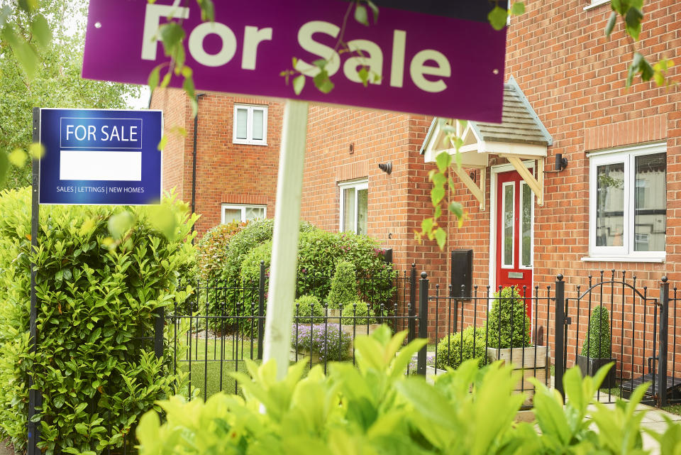 Two Residential homes with For Sale sign out the front