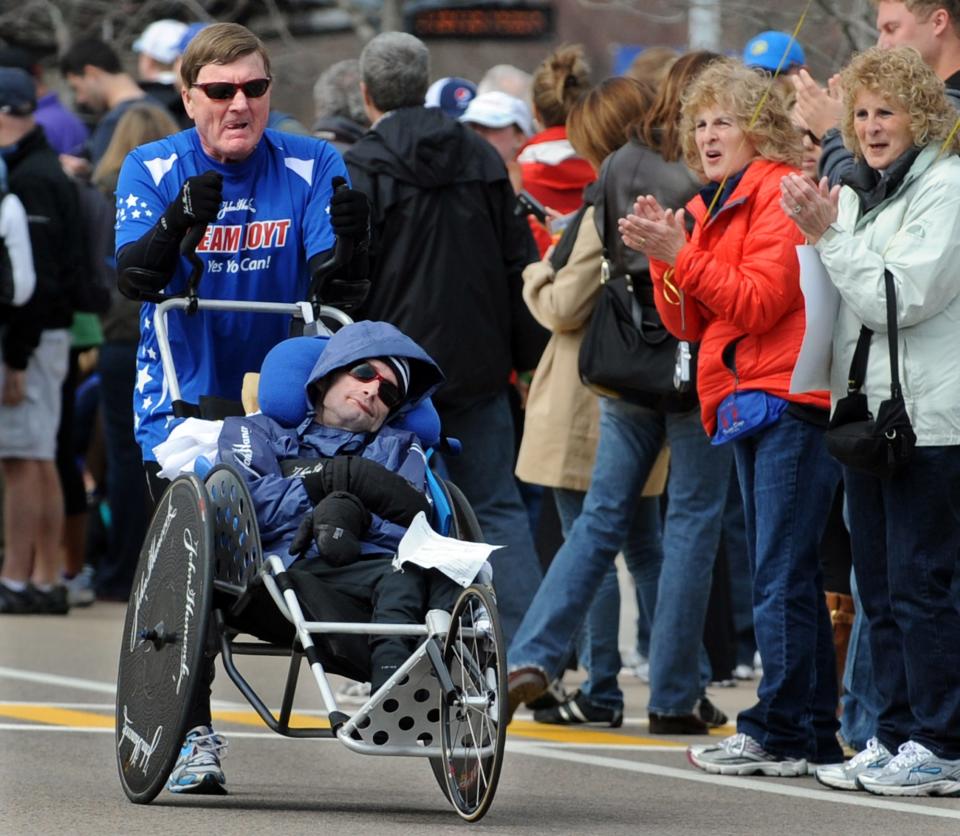 Dick and Ricky Hoyt running their 30th Boston Marathon in Framingham in 2013.
