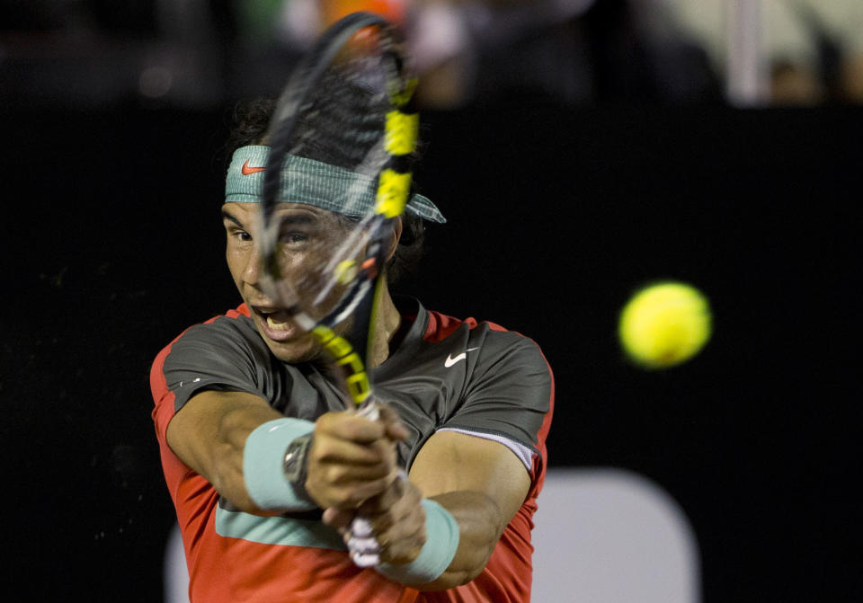 Rafael Nadal of Spain returns the ball to Daniel Gimeno-Traver of Spain at the Rio Open tennis tournament in Rio de Janeiro, Brazil, Tuesday, Feb. 18, 2014. (AP Photo/Silvia Izquierdo)