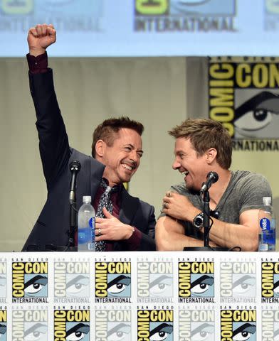 <p>Kevin Winter/Getty</p> Robert Downey Jr. and Jeremy Renner in 2014